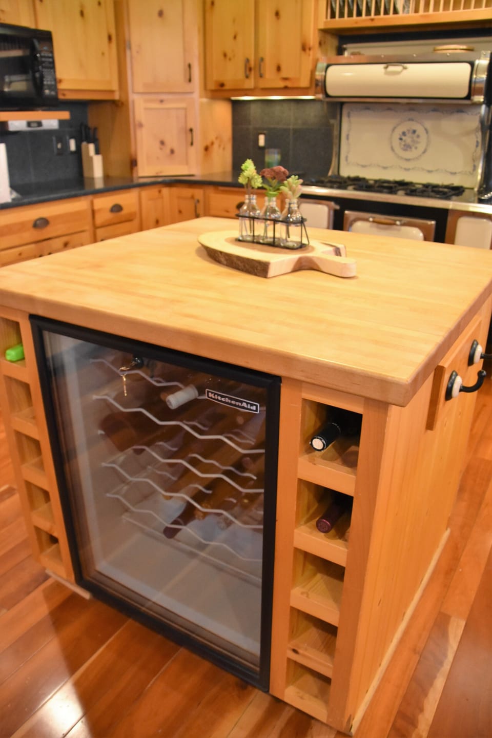 Butcher board island with wine cooler and storage. 