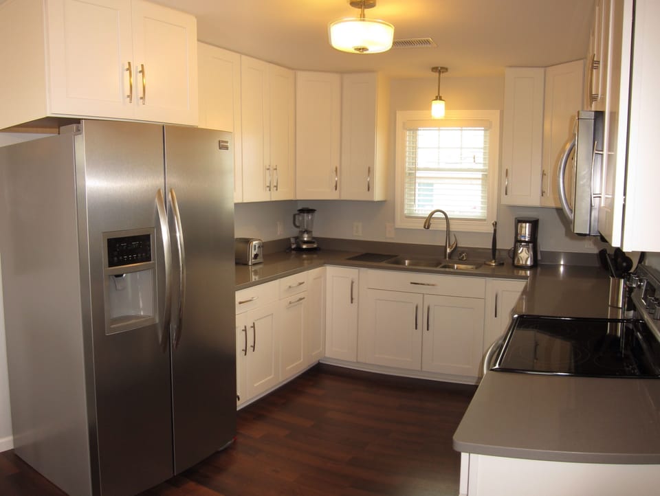 Fully appointed Kitchen with stainless steel appliances &amp; stone countertops
