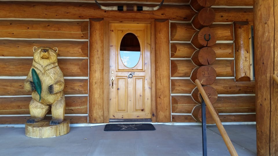 Montana Grizzly welcomes you to the entry of Beaverhead Meadows, custom log home