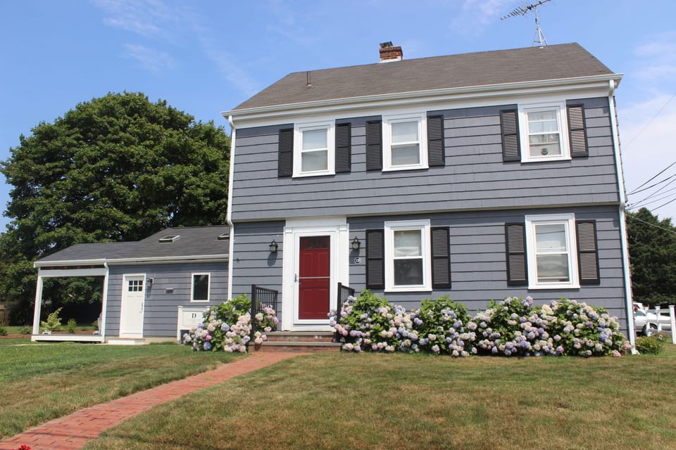 Main house with the apartment and deck on left.