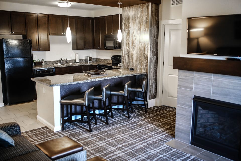 Fully Equipped Kitchen and bar seating, fireplace