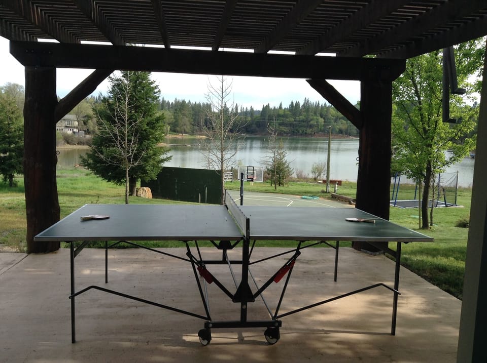 Bunk Room/Game Room Patio with view of mini sport court