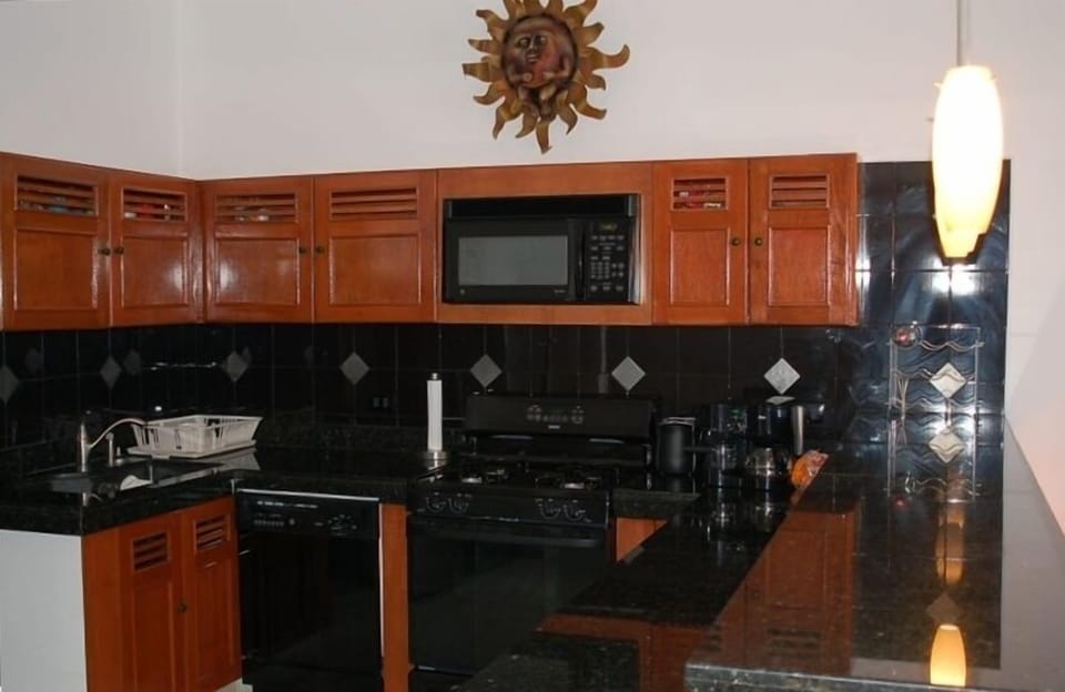 This is the kitchen.  The refrigerator/freezer and laundry area are to the left