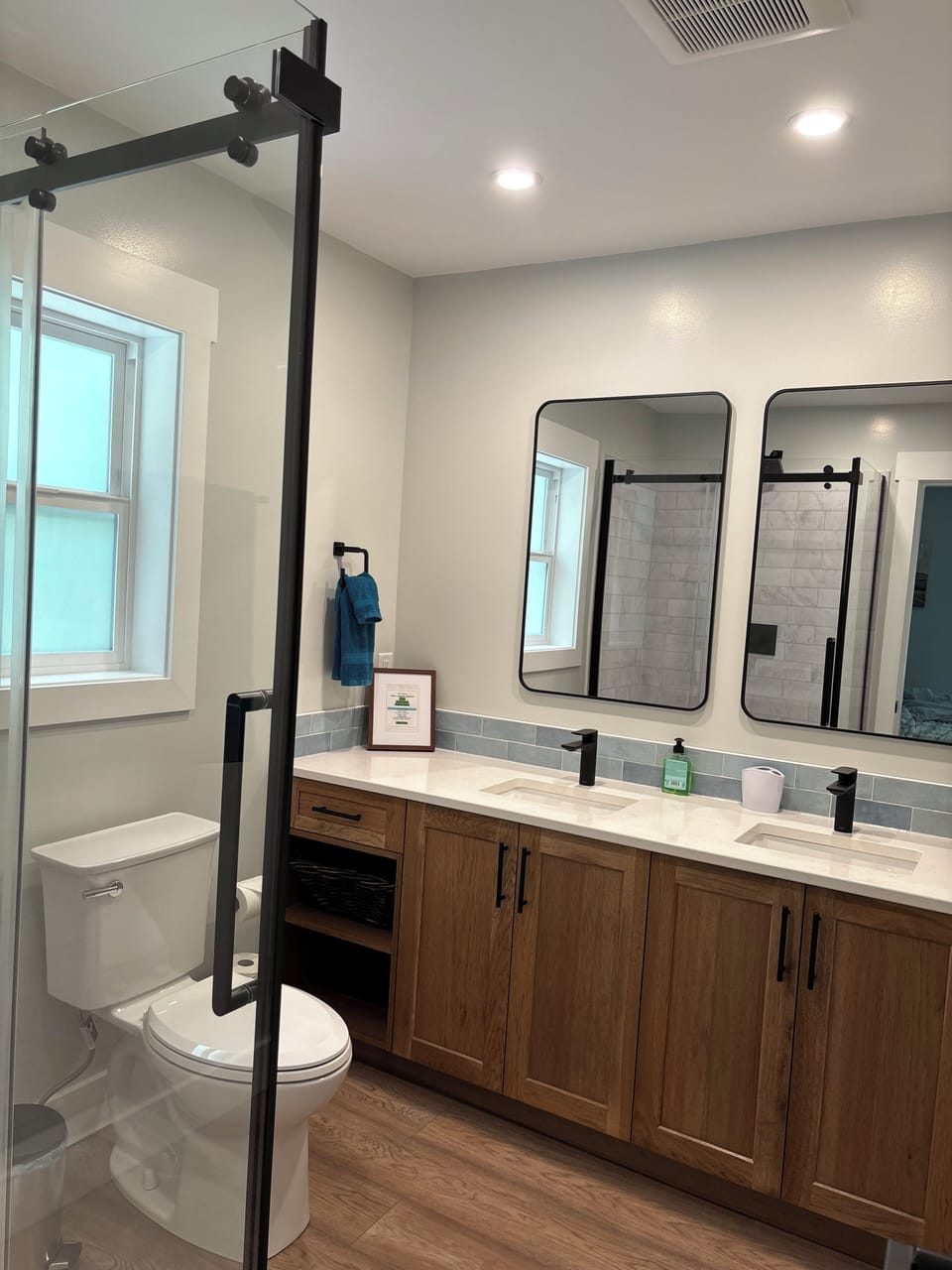 Upstairs - master bedroom ensuite with double vanity.  Custom hickory cabinets. 