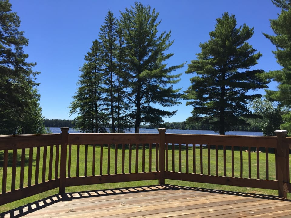 Gorgeous lakeside deck with permanent charcoal grill & deck seating