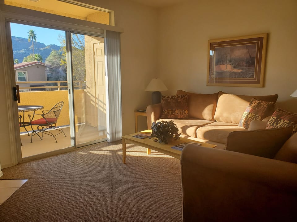 Nicely appointed living room with pullout couch and full sofa bed.