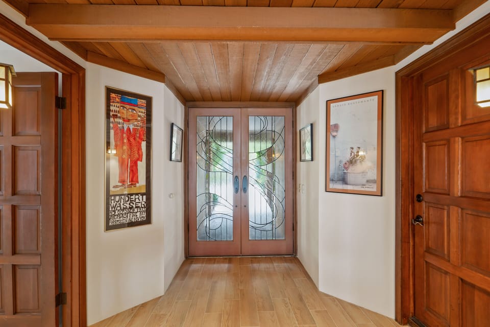 THE FRONT DOOR FROM INSIDE ENTRYWAY; GARAGE DOOR RIGHT; OFFICE/BED & BATH LEFT