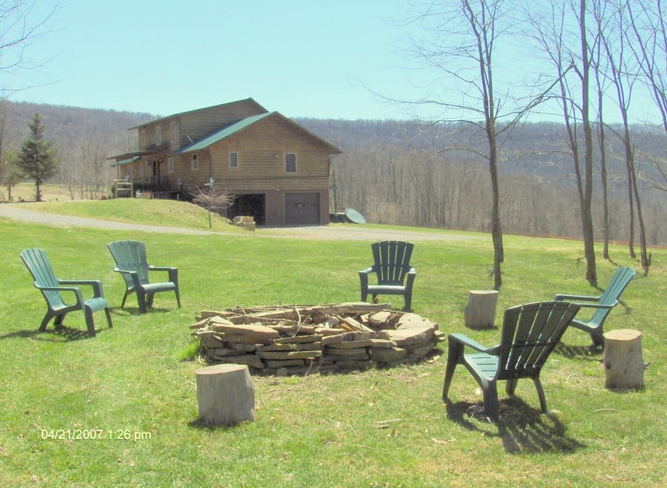 Firepit with plenty of firewood to burn.
