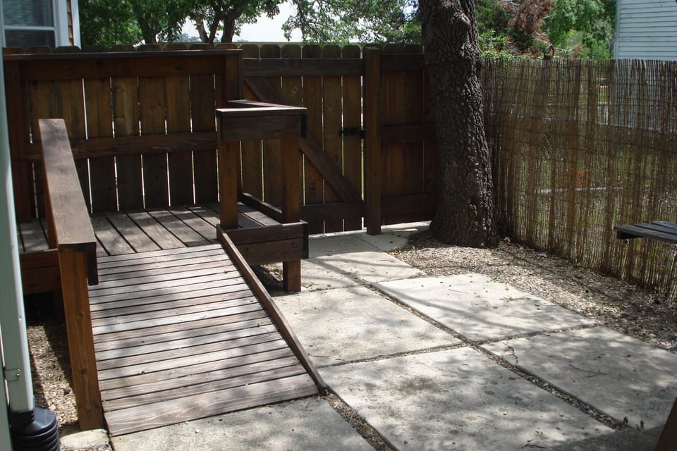 Private, shady patio w/ramp to back door. Gas grill and lawn chairs provided.