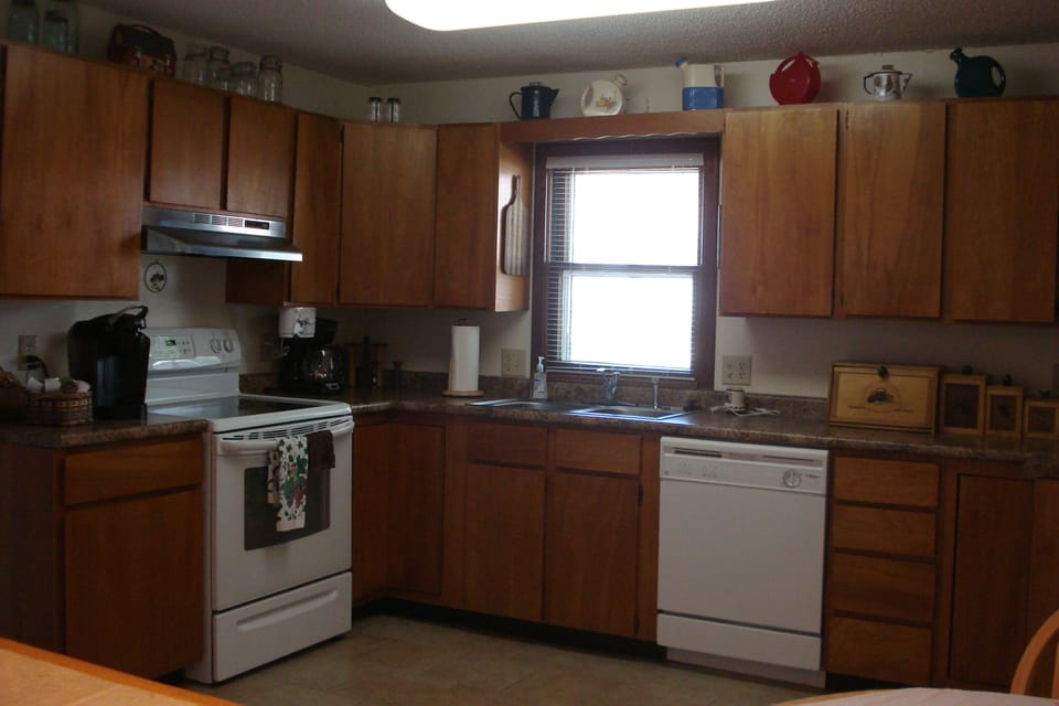 Fully stocked kitchen. Dishwasher. Fridge w/ice in door. Microwave. Tile floors.
