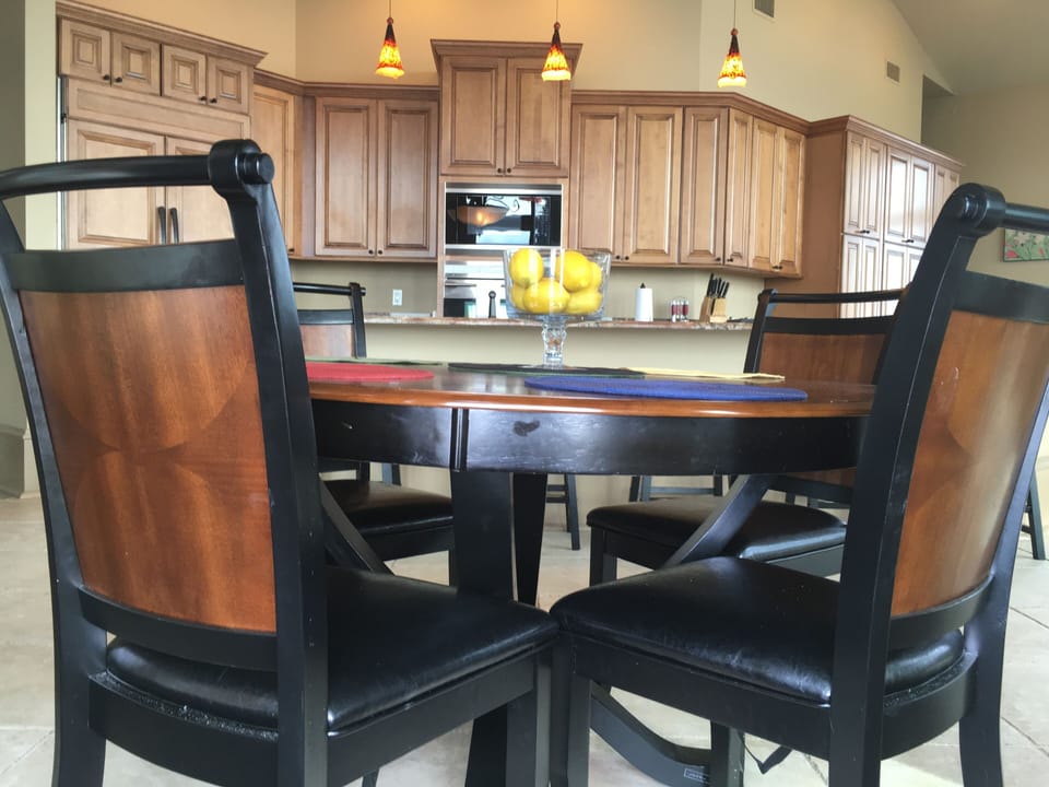 2nd Dinning Area.  Four chairs with 5 bar stools at the bar area  (2nd Floor).