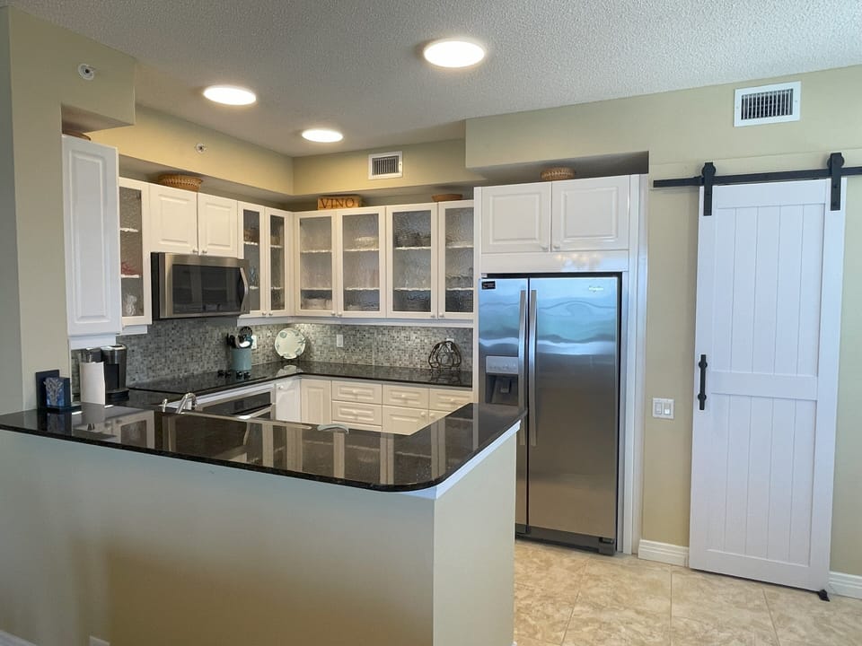 Fully-equipped Kitchen features Granite Counters and Stainless Steel Appliances