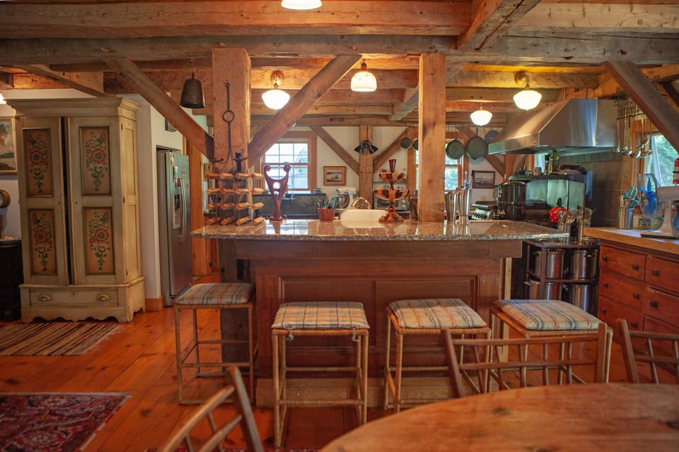 VIEW FROM DINING ROOM WITH GRANITE BAR INTO KITCHEN