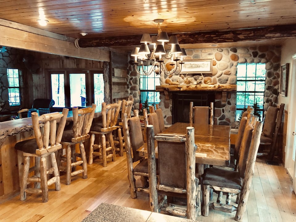 Dining area - with open live edge bar looking into family room.
