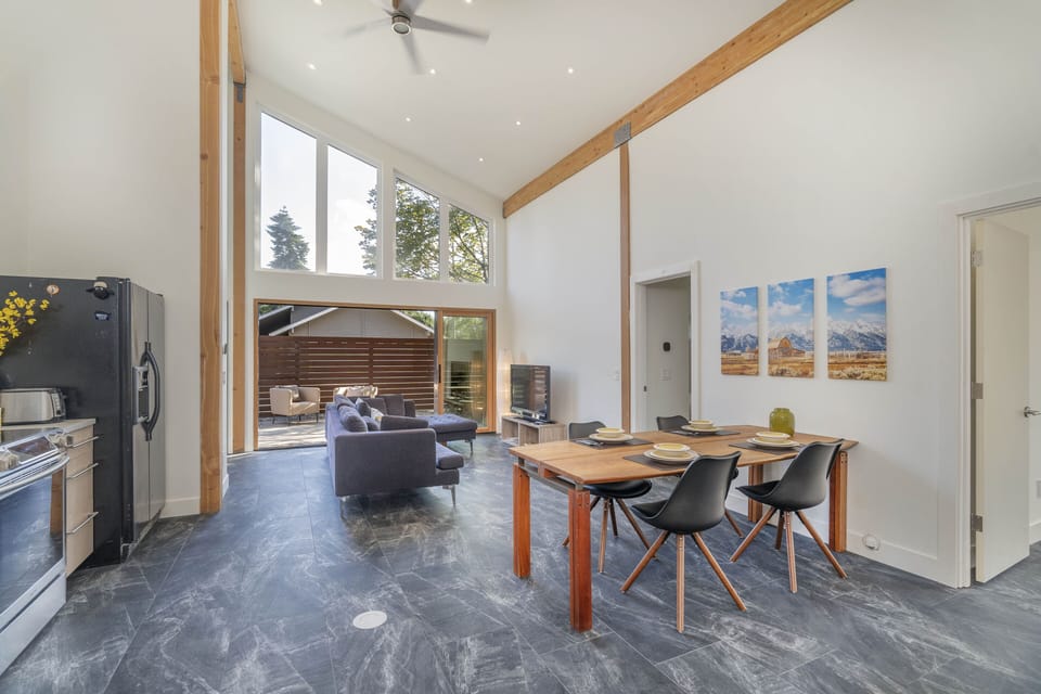 Open concept Living, Nana walls open up to fenced private garden and patio