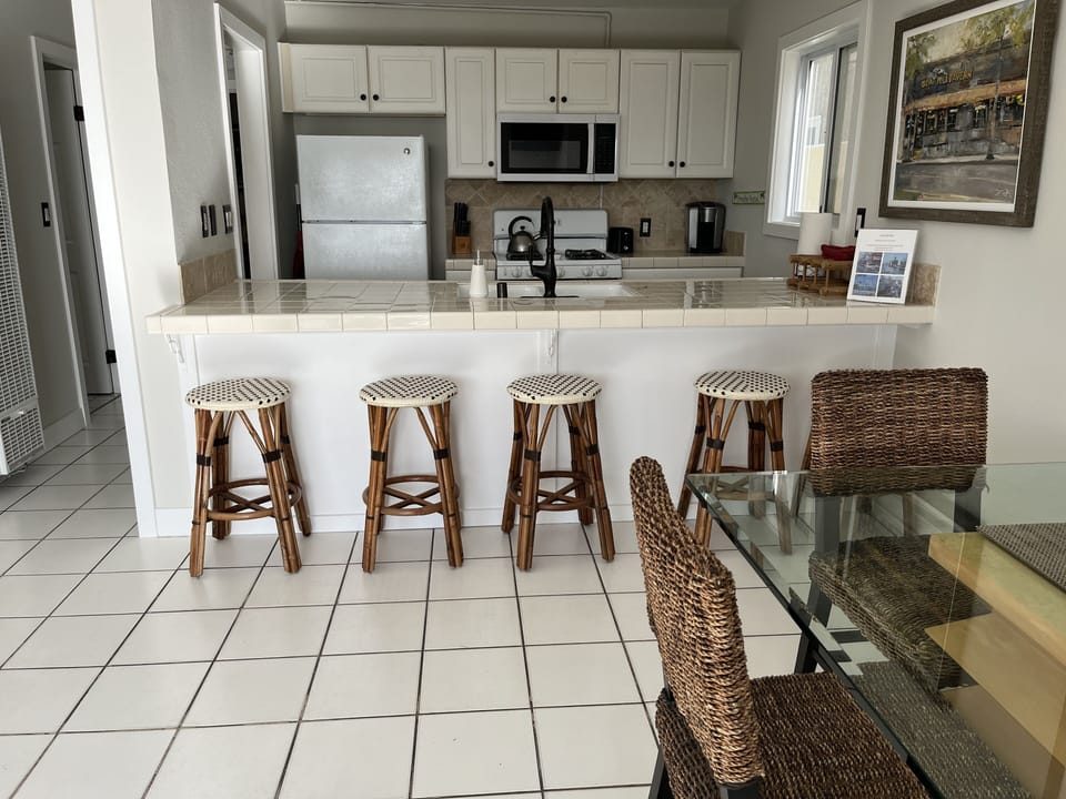 Dining area, counter and kitchen