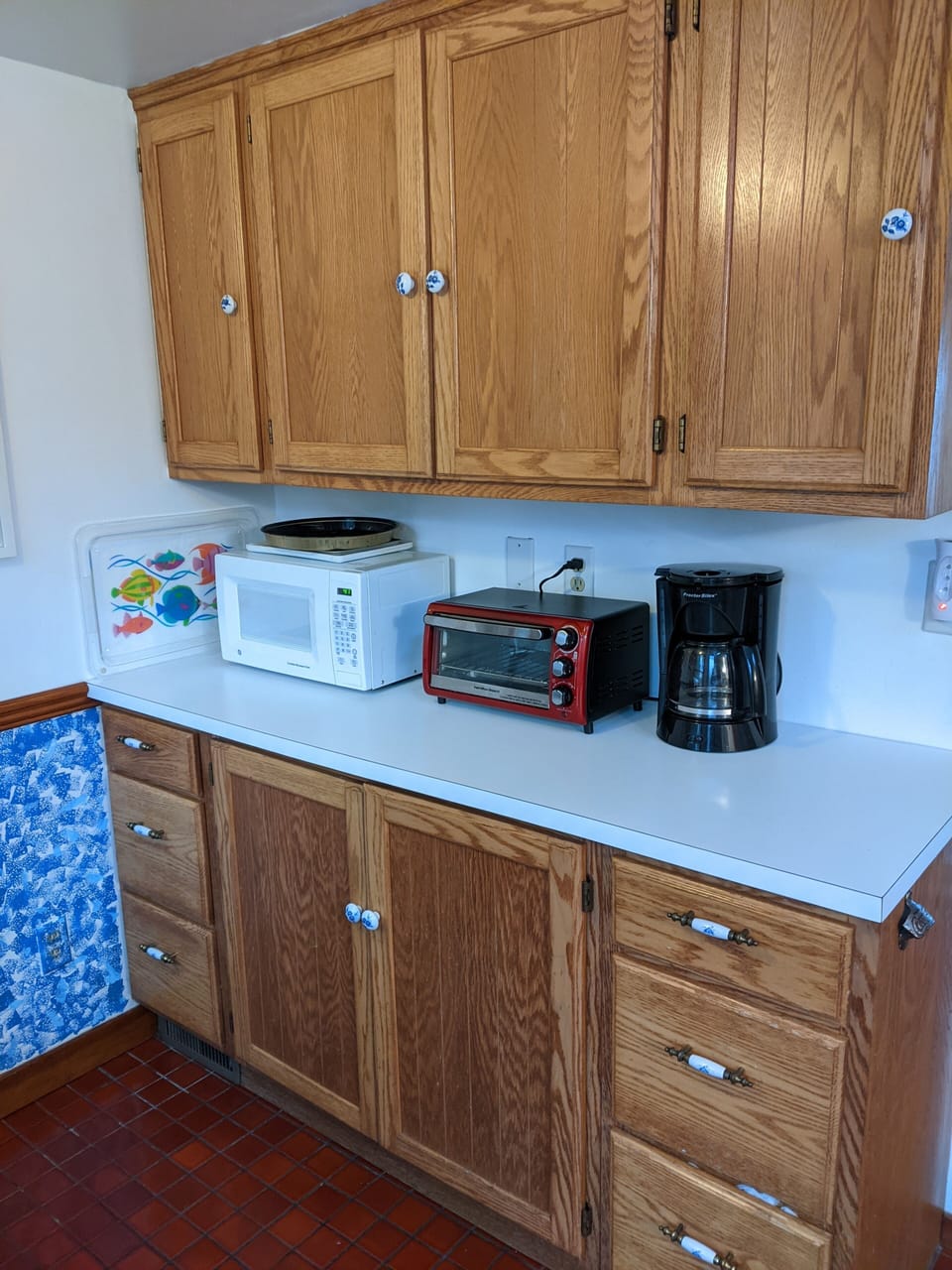 Our kitchen has a microwave, toaster oven and drip coffee pot (filters provided)