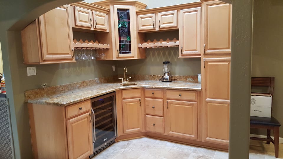 Wet bar area with wine cooler, glasses for all occasions.