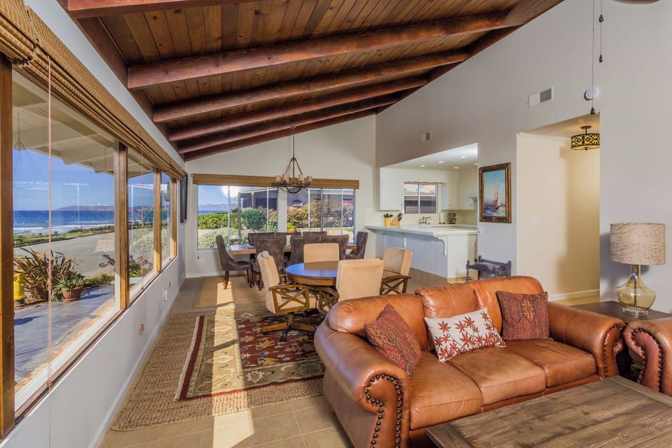 The best part of this home is the large, open common living area with 180 degree  ocean views. 