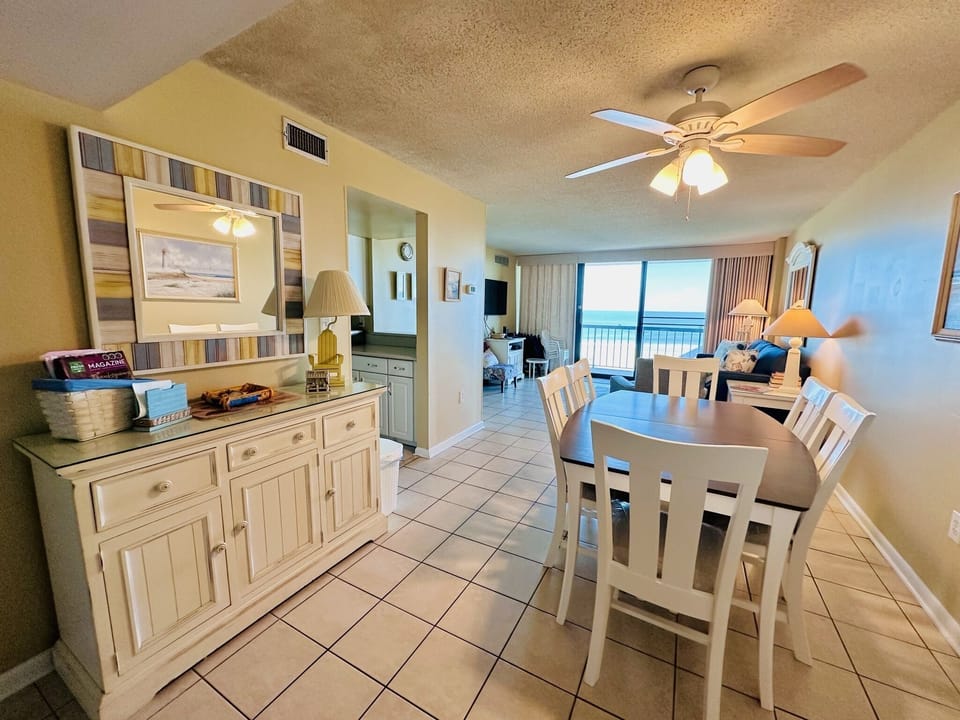 dining and living area overlook the ocean
