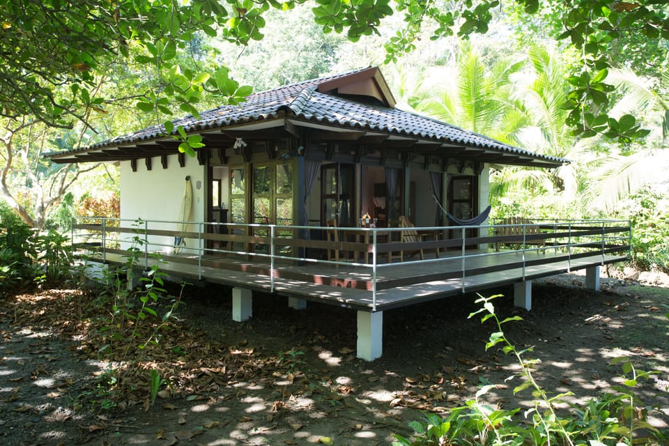 A view from the beach gate. The front windows open onto a spacious terrace.