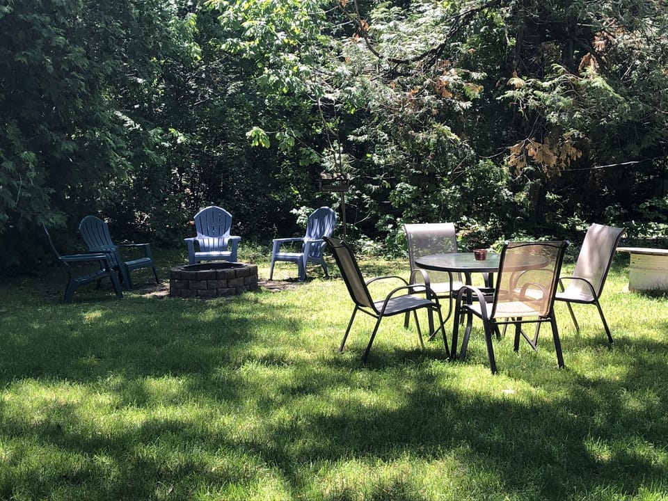 Backyard fire pit and seating area (gas bbq grill included, but not in picture)