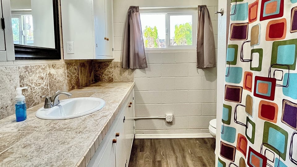 Hall bathroom with combination tub/shower