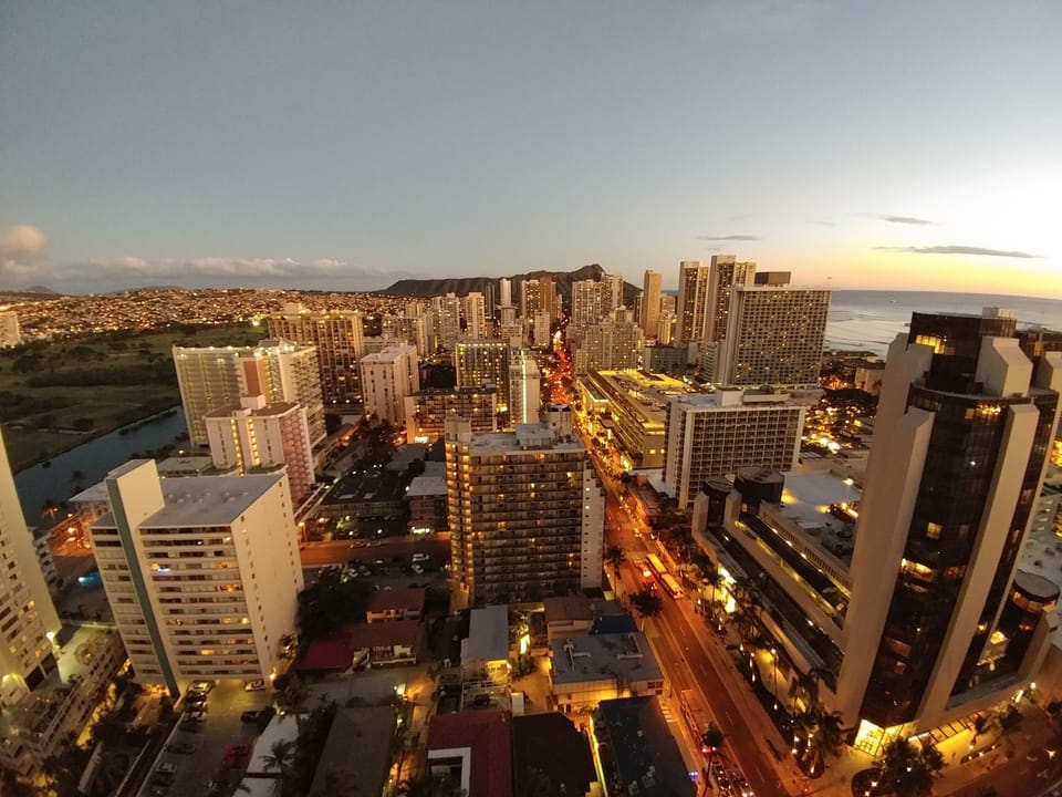 The sun sets on Waikiki and Diamond Head.