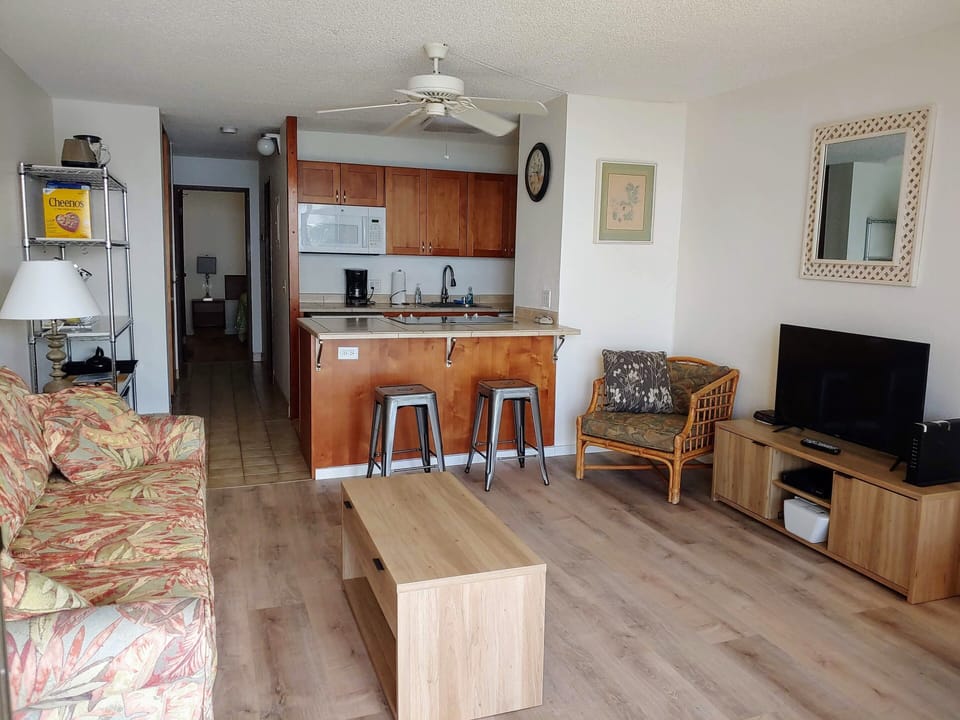 From the lanai, new 40" tv and stand, coffee and end tables,  and flooring.
