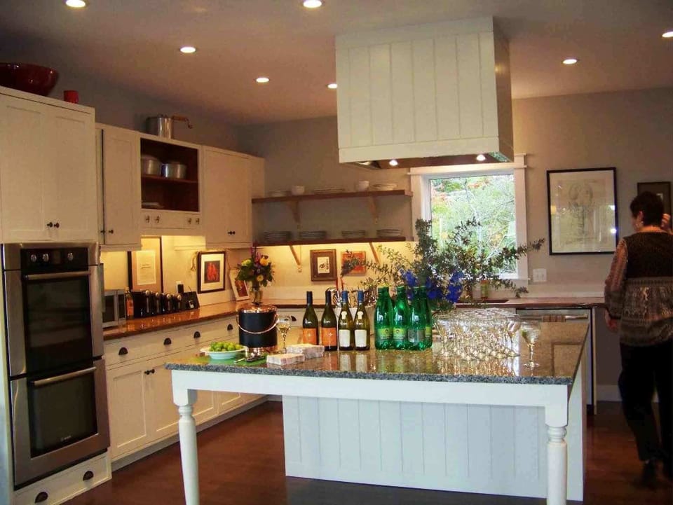 Kitchen at night with setup for a dinner party