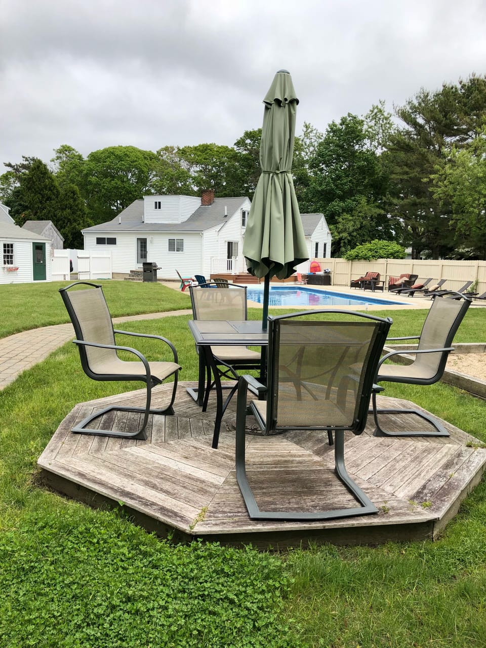 Lawn deck with table and chairs for wine nights 