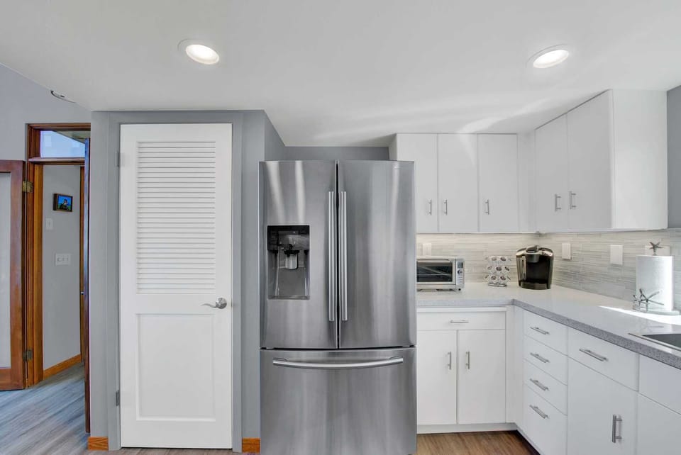 New counter tops/back splash, all new appliances. New square white dinner, salad plates and bowls with plenty of beautiful serving dishes, pots and pans and utensils, you name it we have it!