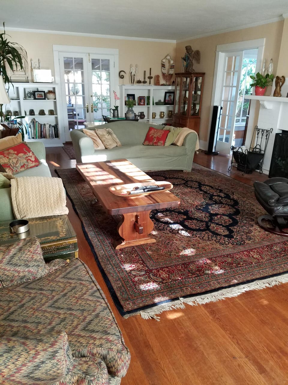 Living room facing to back porch, playroom on right