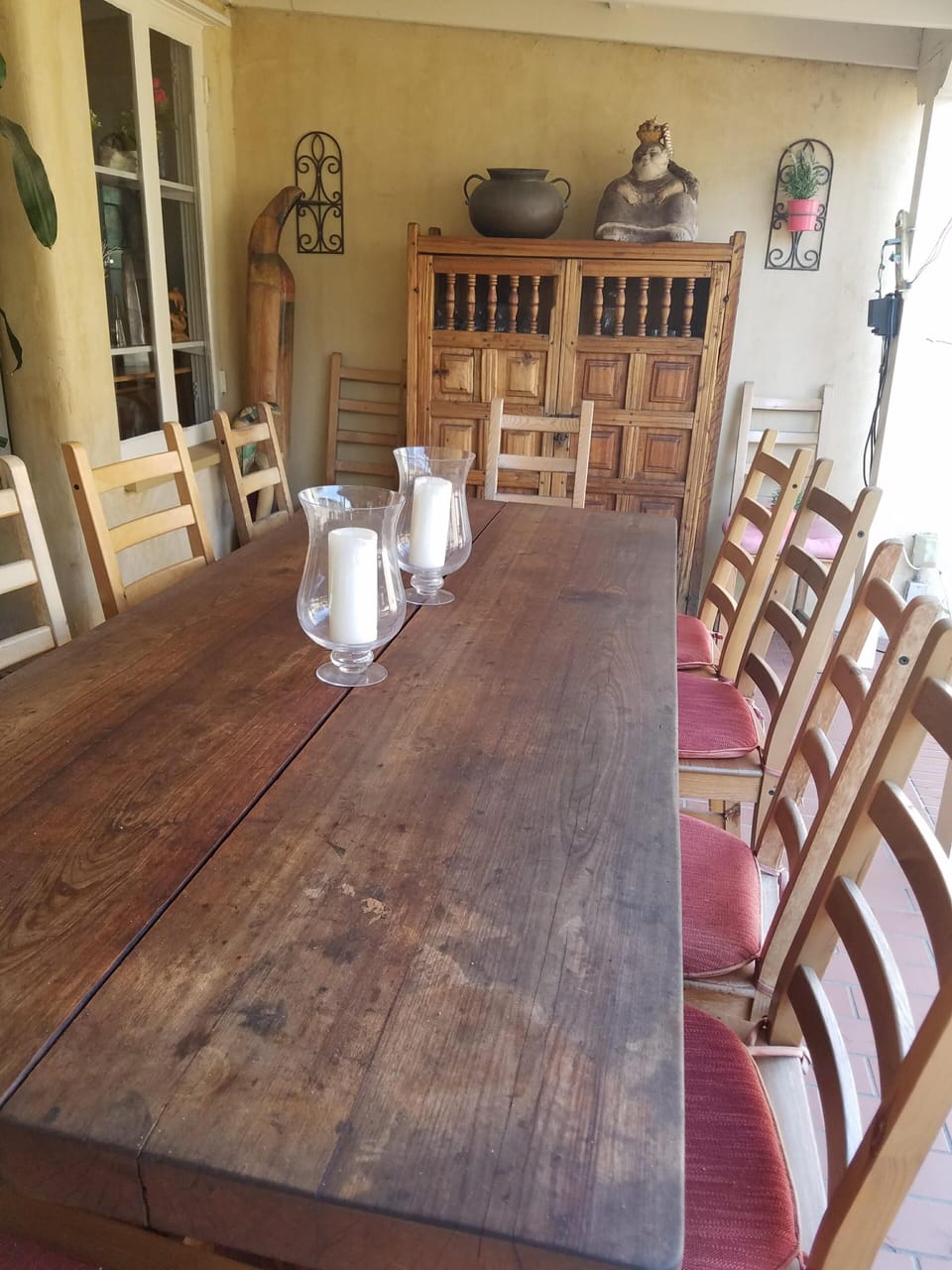 Covered back patio - table seats 12.  Living room to left through French doors.