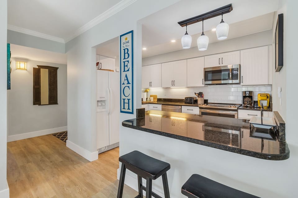 Open, fully equipped kitchen and washer and dryer