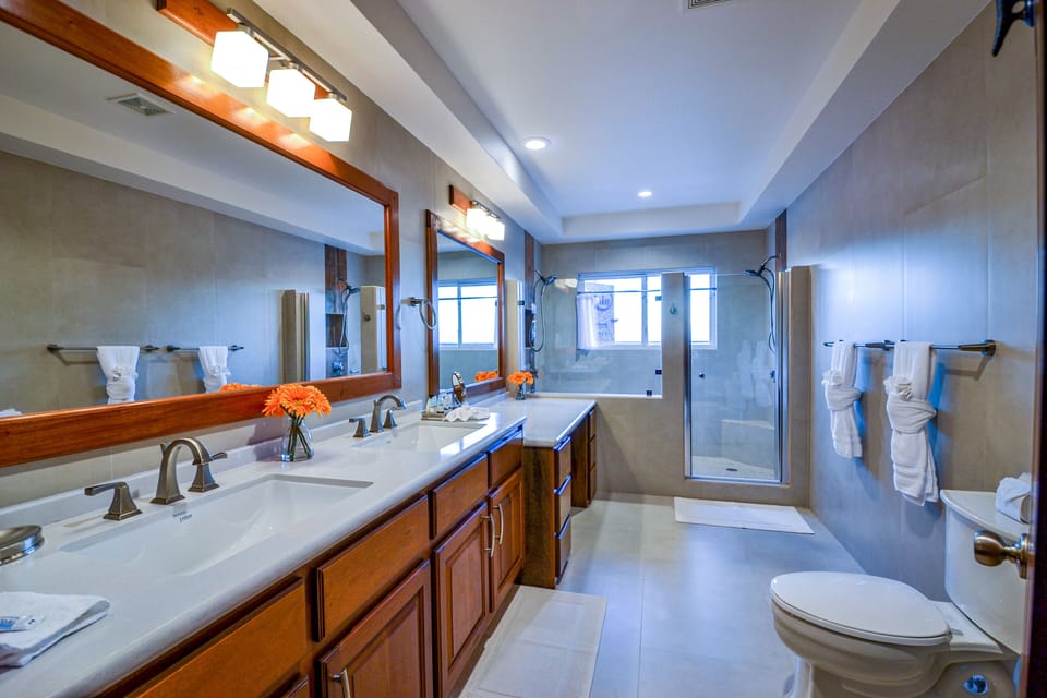 Unit F9 - 4th-floor Master bath with dual sinks, dual shower, and make-up vanity