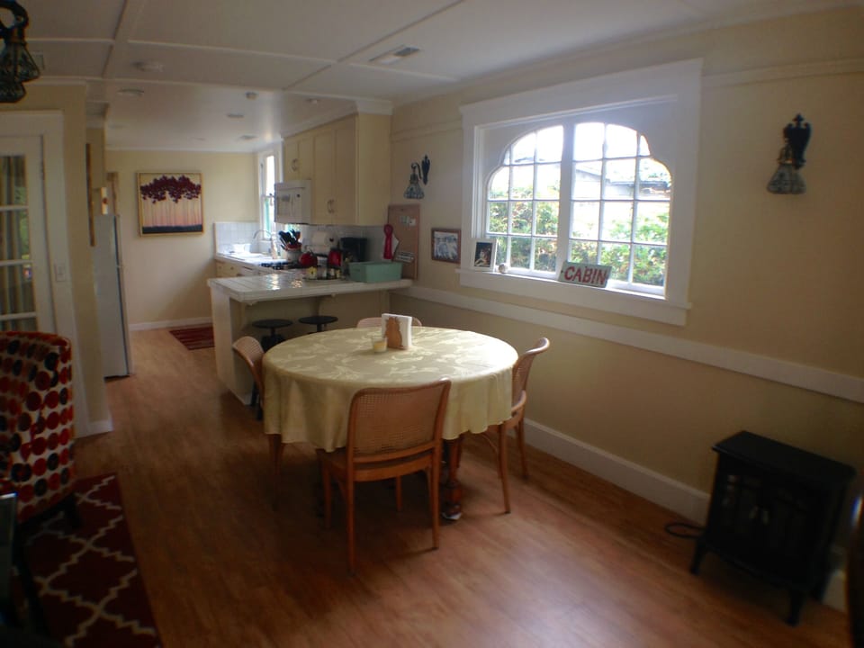 Original curvy window skirts the dining area