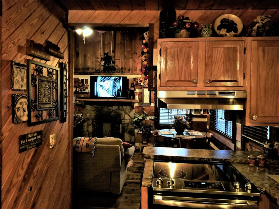 Family is never separated when preparing meals in kitchen that joins living area