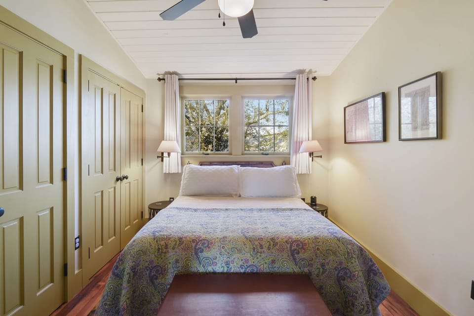 Bedroom with queen size bed and two closets. 