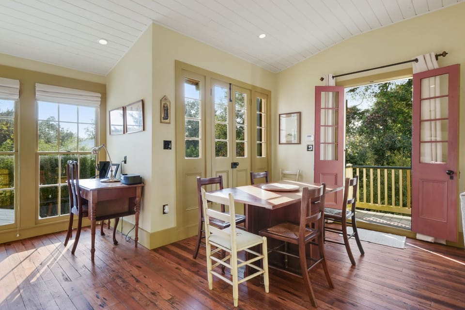 Dining area and French doors leading out to balcony over looking the pool