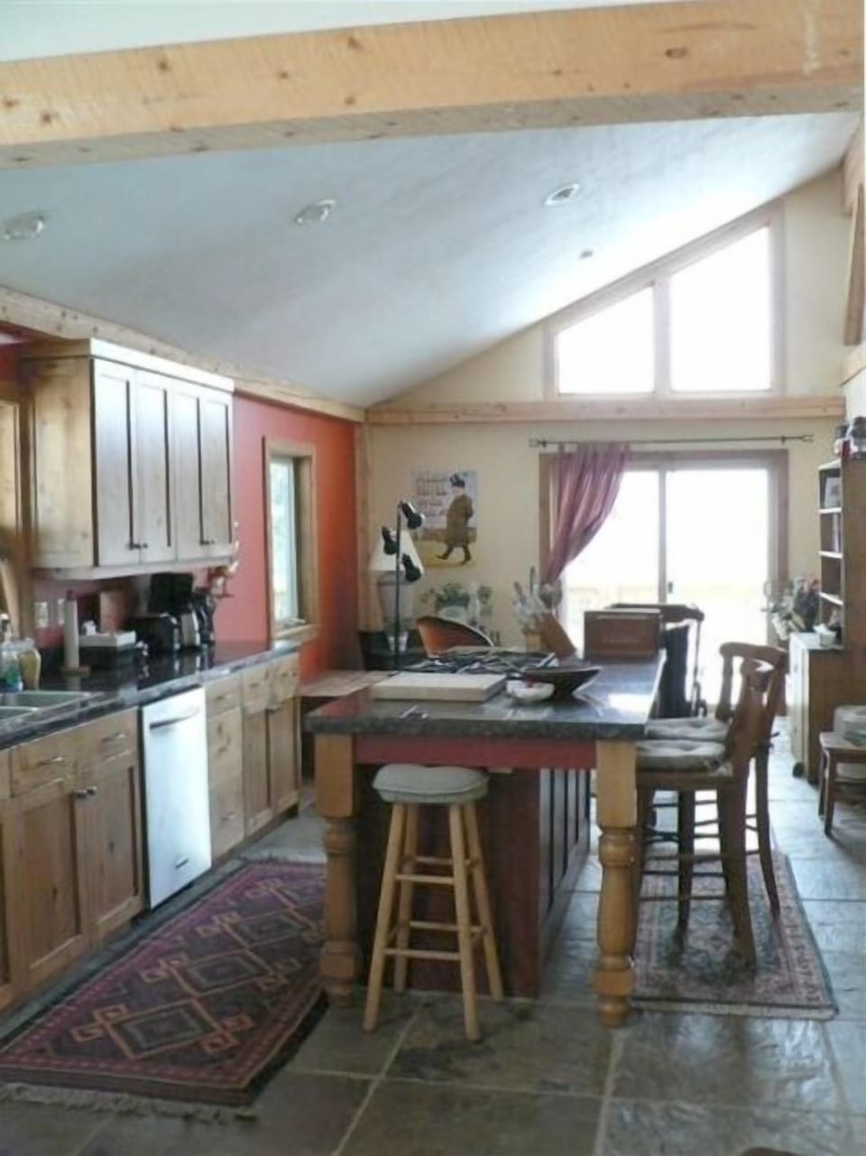 View of kitchen and sitting room- granite countertops, stainless appliances