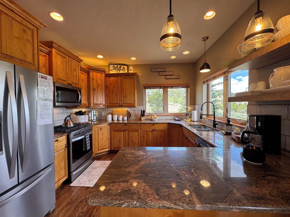 Well-appointed kitchen with warm wood finishes.