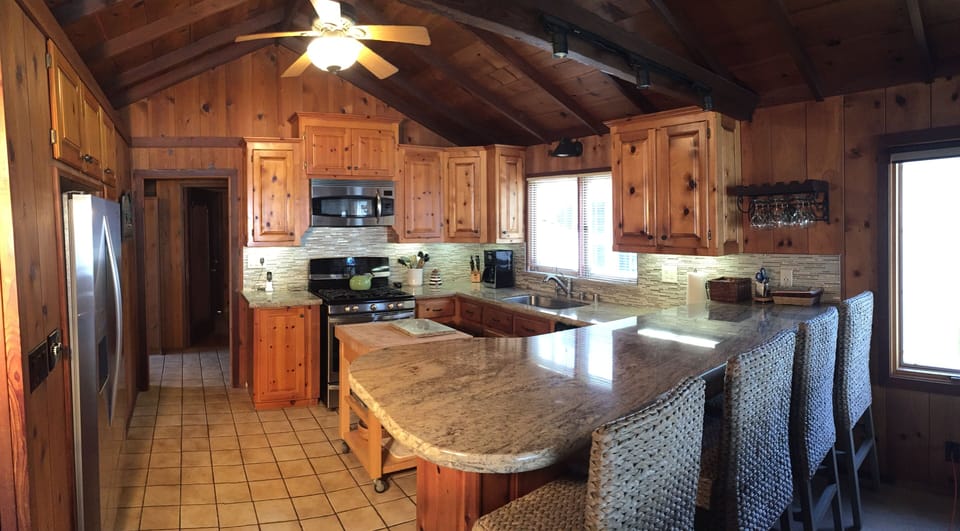 Well equipped and updated kitchen with granite counters and great breakfast bar