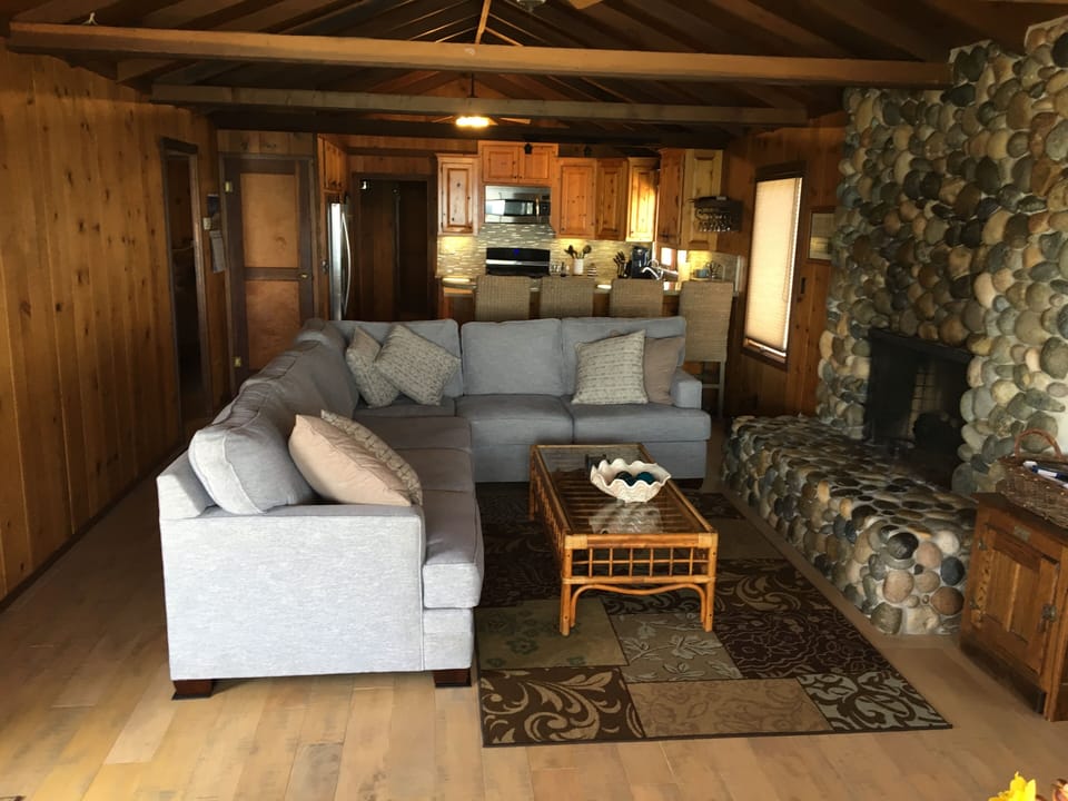 our cozy living room with river rock gas fireplace- plenty of seating
