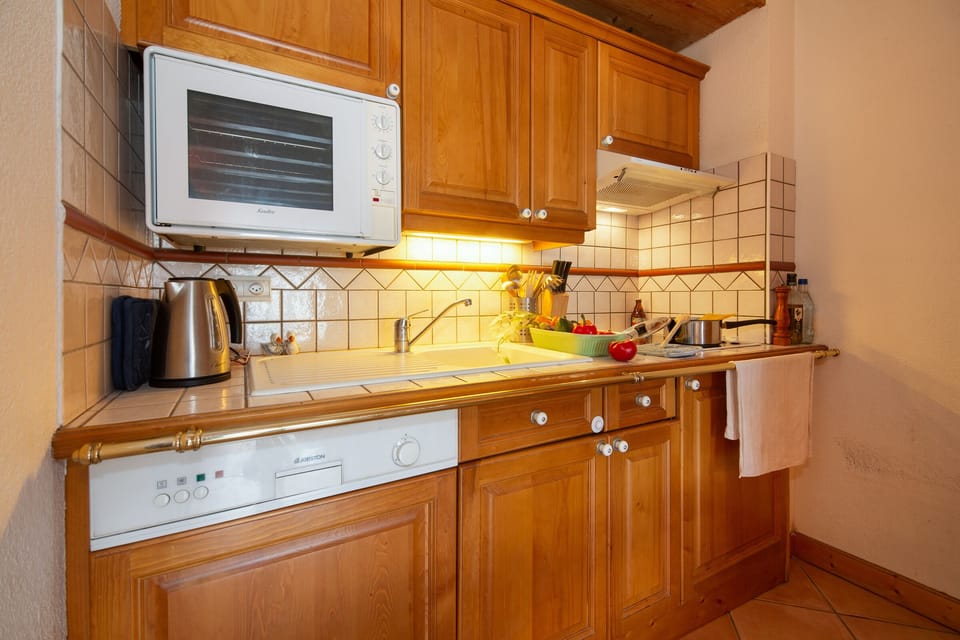 well equipped kitchen with a dishwasher
