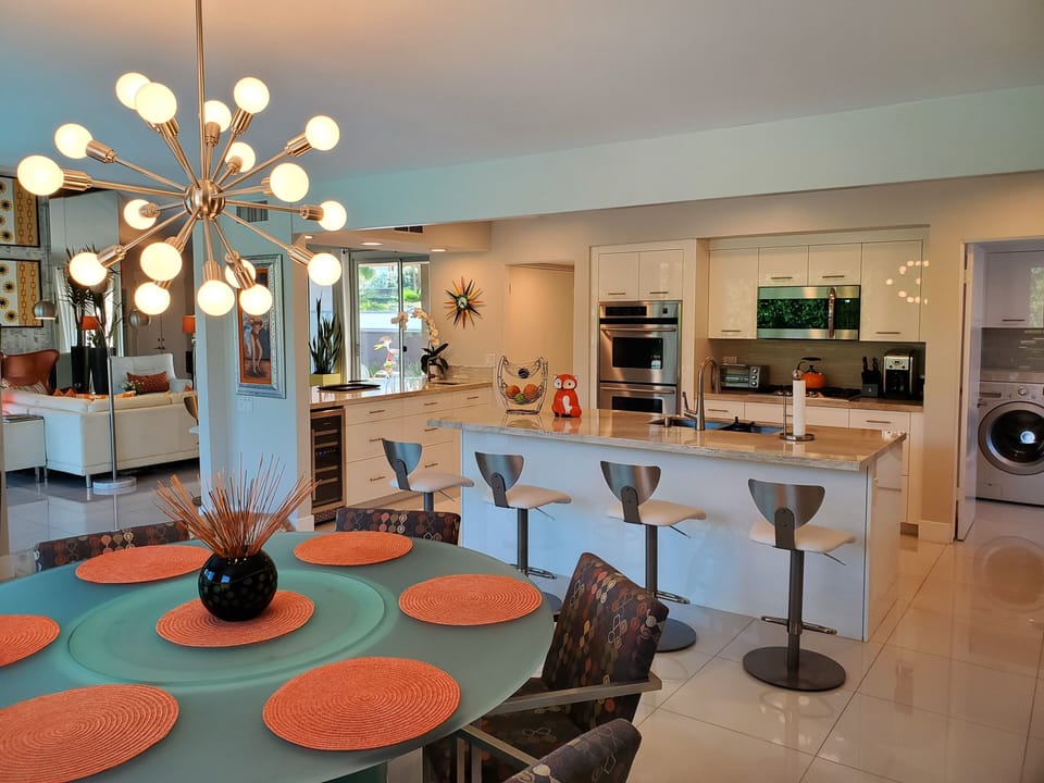 Dining Room looking into Kitchen, islands and Great Room