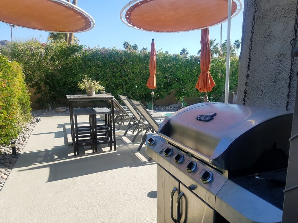 Barbeque in backyard off pool/patio