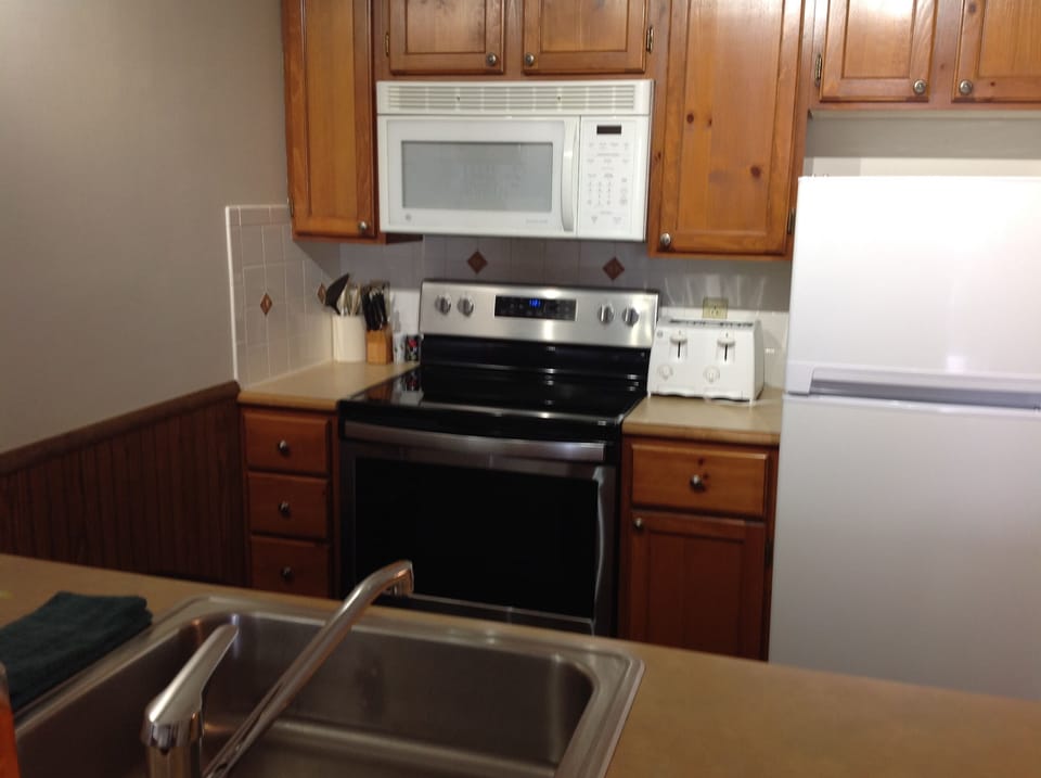 Kitchen with new ceramic cook top stove