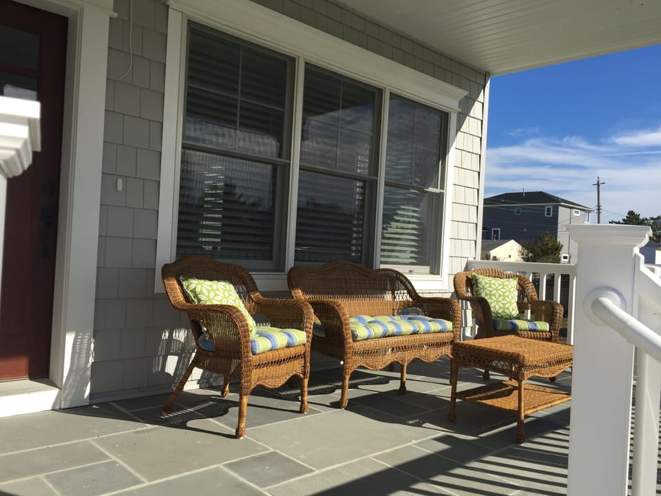 Relax on the covered  front porch 