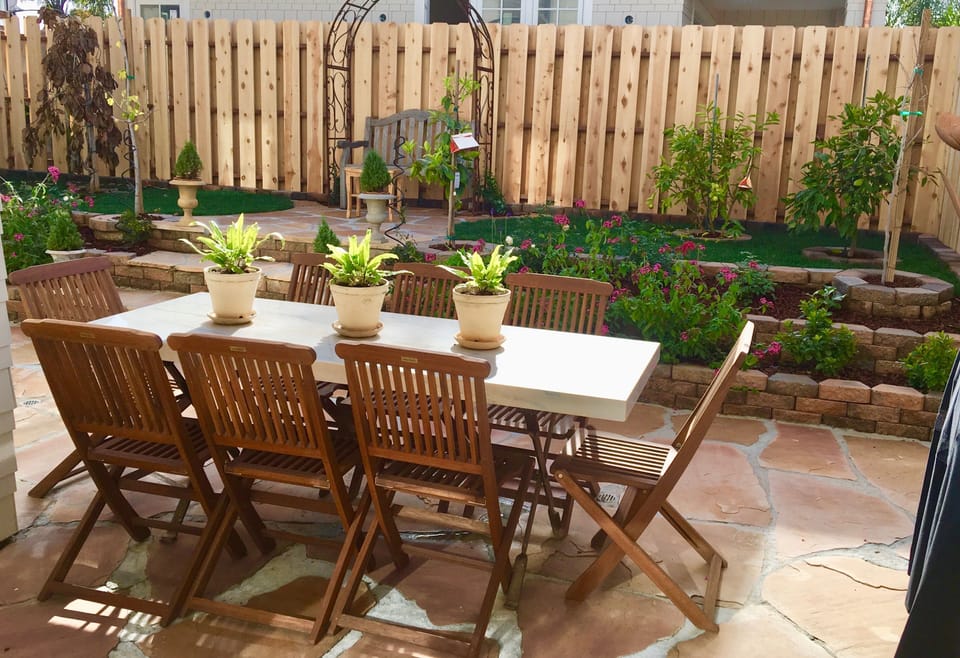 Peaceful garden with marble table for dining off the formal dining room